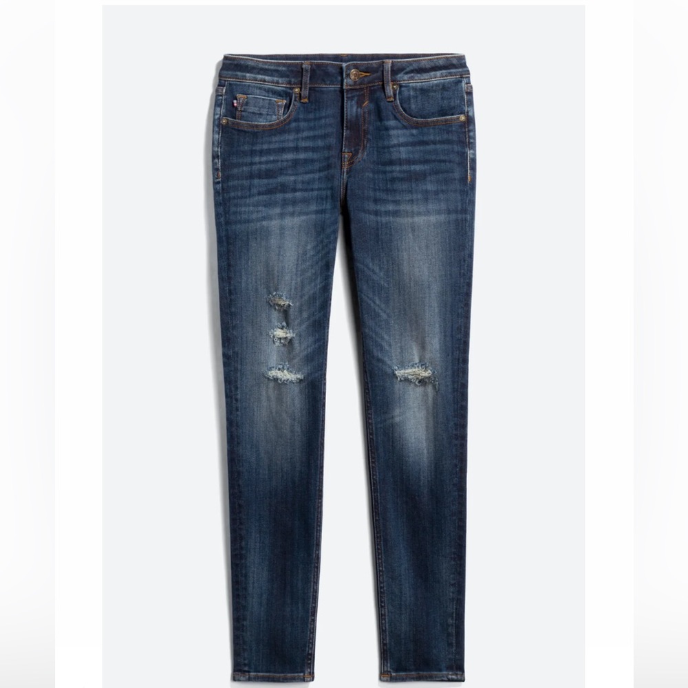 Jagger Mid-rise distressed skinny jeans.